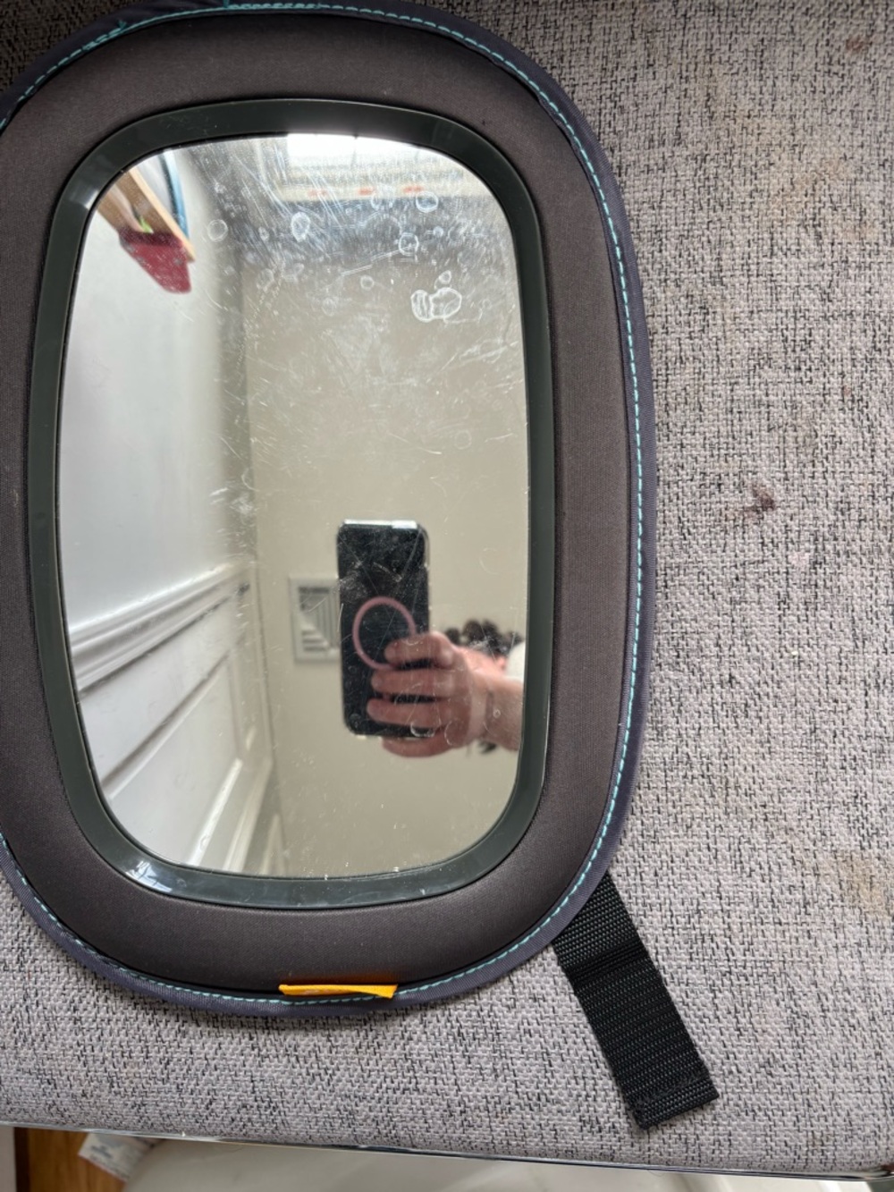Oval Travel Mirror with Padded Brown Frame and Teal Stitching